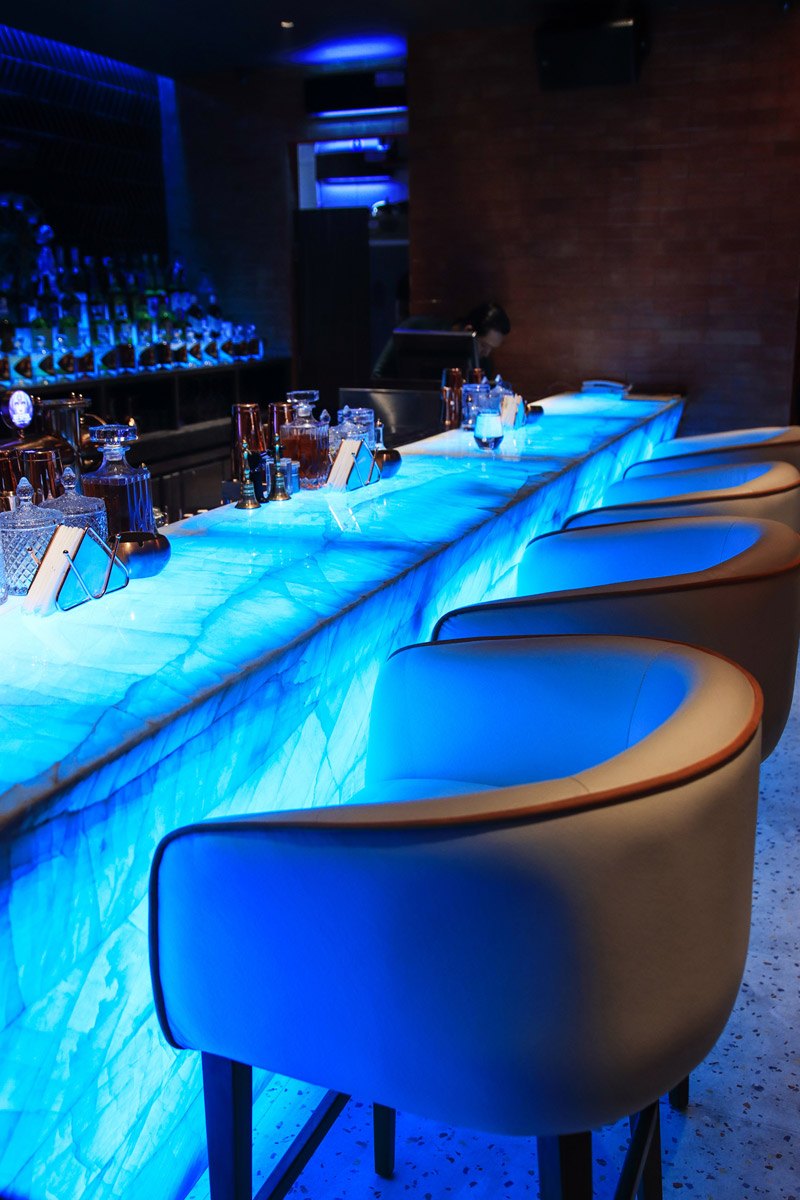Restaurant bar interior illuminated onyx at Queen’s Tandoor Indian Restaurant Bali