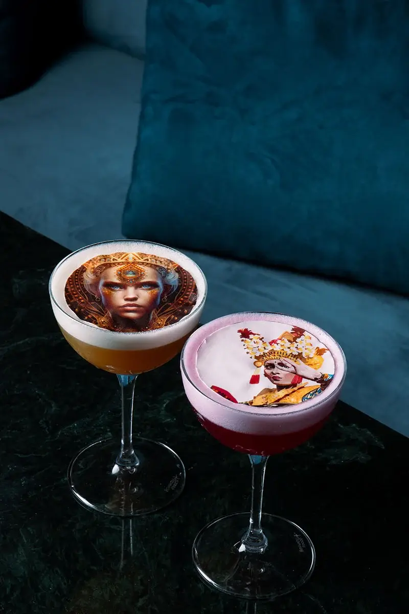 Signature Craft Cocktails on a marbled table and blue sofa background at Queen’s Tandoor Indian Restaurant Seminyak Bali