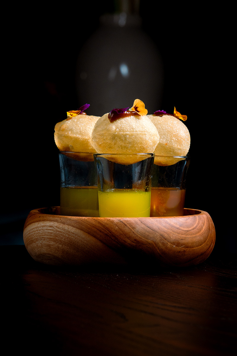 3 colorful Pani Puri on a wooden bowl at Queen’s Tandoor Indian Restaurant Seminyak Bali